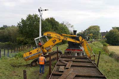 JCB loading onto well wagon