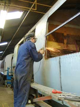 Grinding the welds round window, 23 April 2003