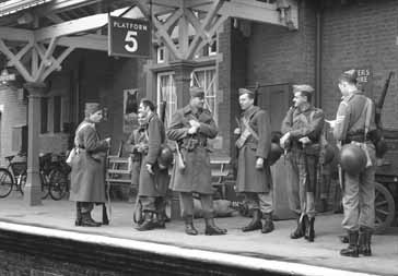 Soldiers await their train