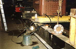 [View of hydraulic testing pump with pressure on gauge.]