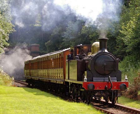 The relaunch train emerges from the tunnel at West Hoathly - Derek Hayward