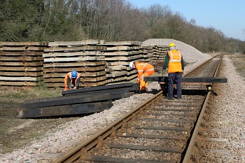 New and reclaimed sleepers being loaded on to the trolley at West Hoathly